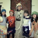 Султанова Рауза Рифкатовна в окружении моделей детской одежды